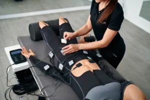 Placement d'électrodes EMS sur un client